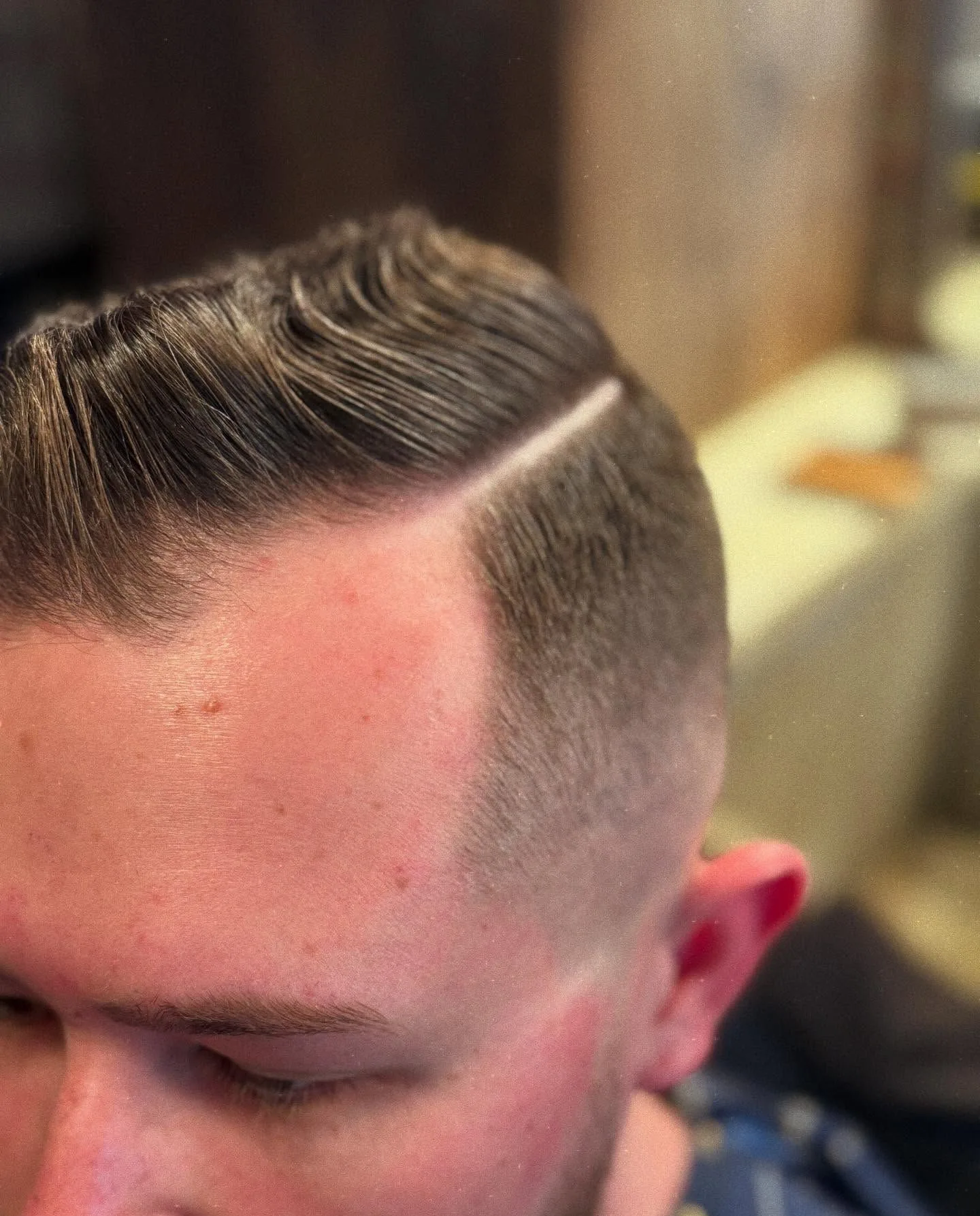 A clean finished fade with a sharp part line