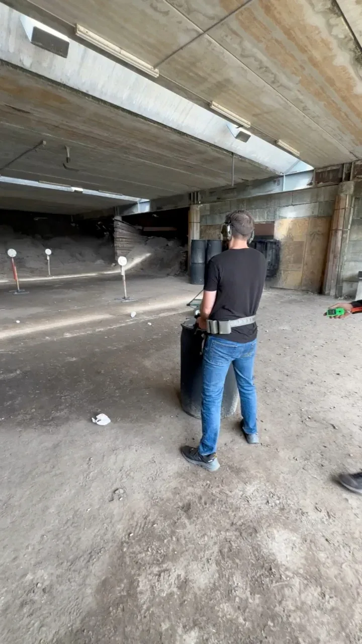 A member of the Barley and Mane team facing the targets at an outdoor shooting range